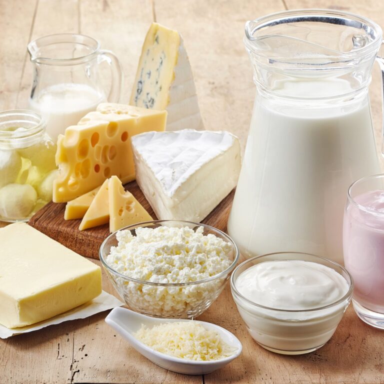 Various fresh dairy products on wooden background