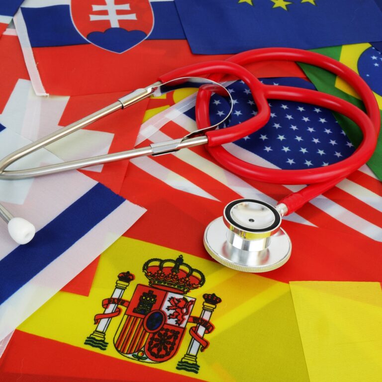 Medical tourism and medicine in different countries concept. Red stethoscope on national flags background.