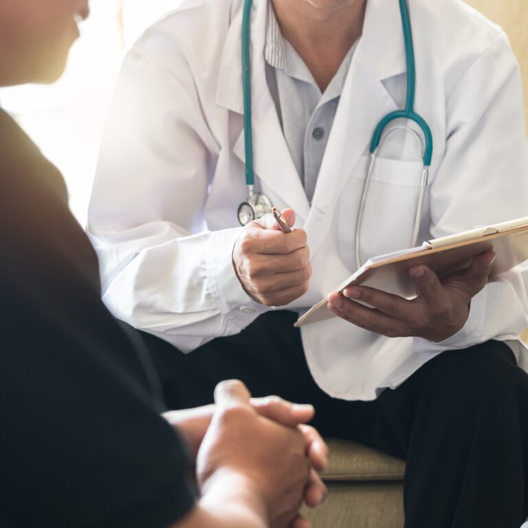 Men's health exam with doctor or psychiatrist working with patient having consultation on diagnostic examination on male disease or mental illness in medical clinic or hospital mental health service