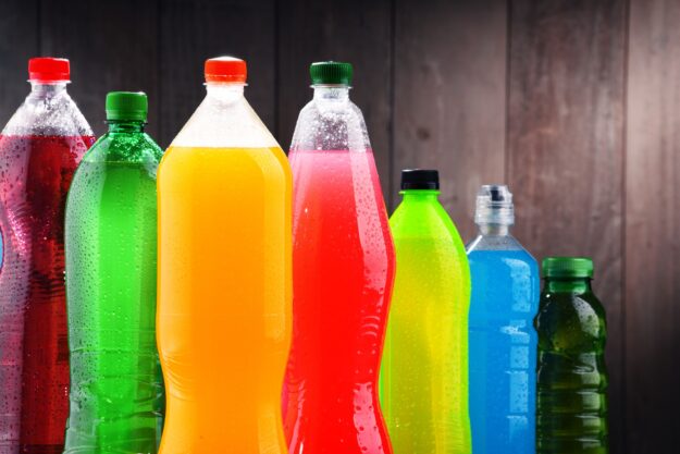 Plastic bottles of assorted carbonated soft drinks Plastic bottles of assorted carbonated soft drinks in variety of colors